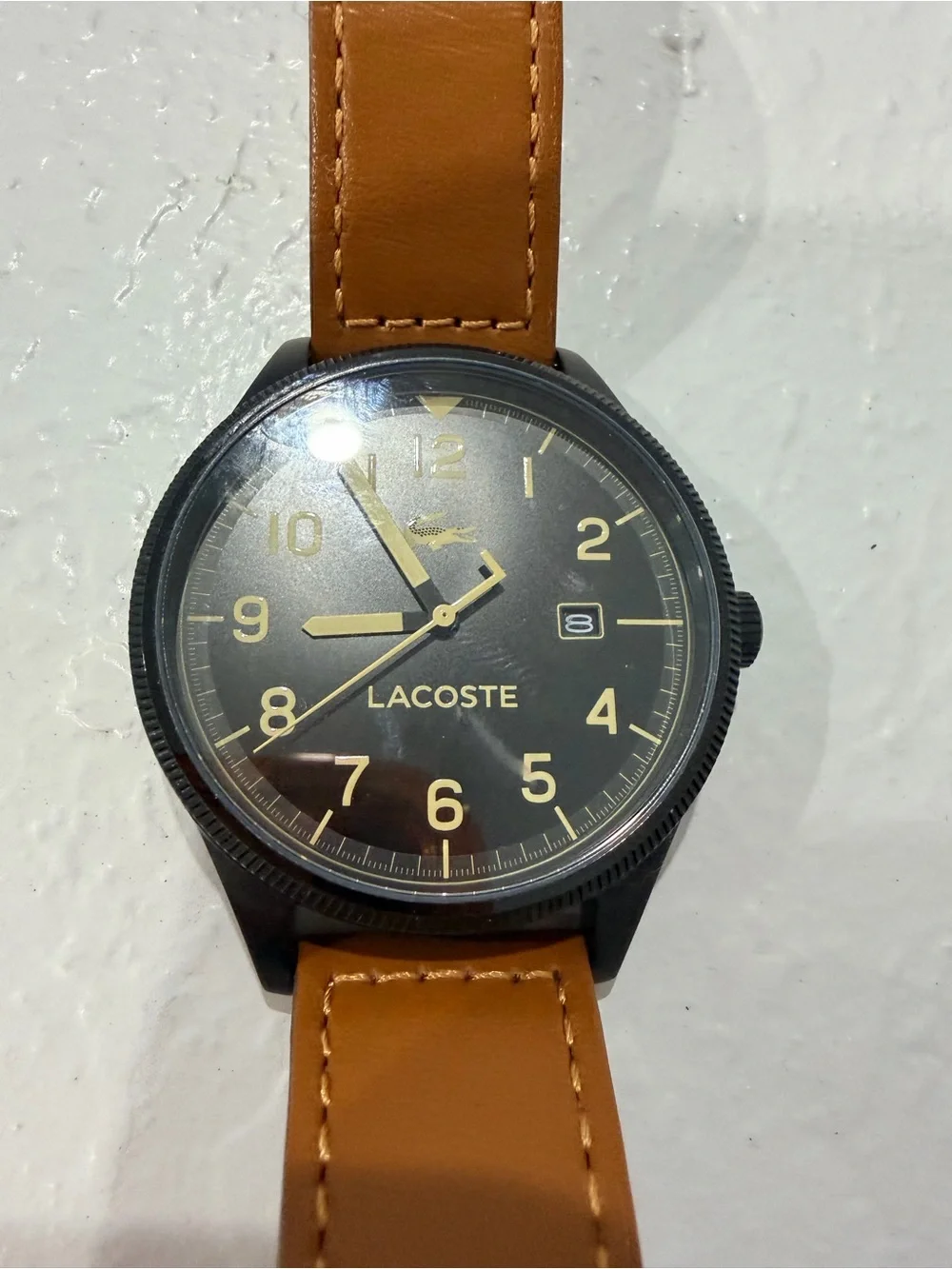 Lacoste Black Dial Watch with Tan Strap and Gold Accents